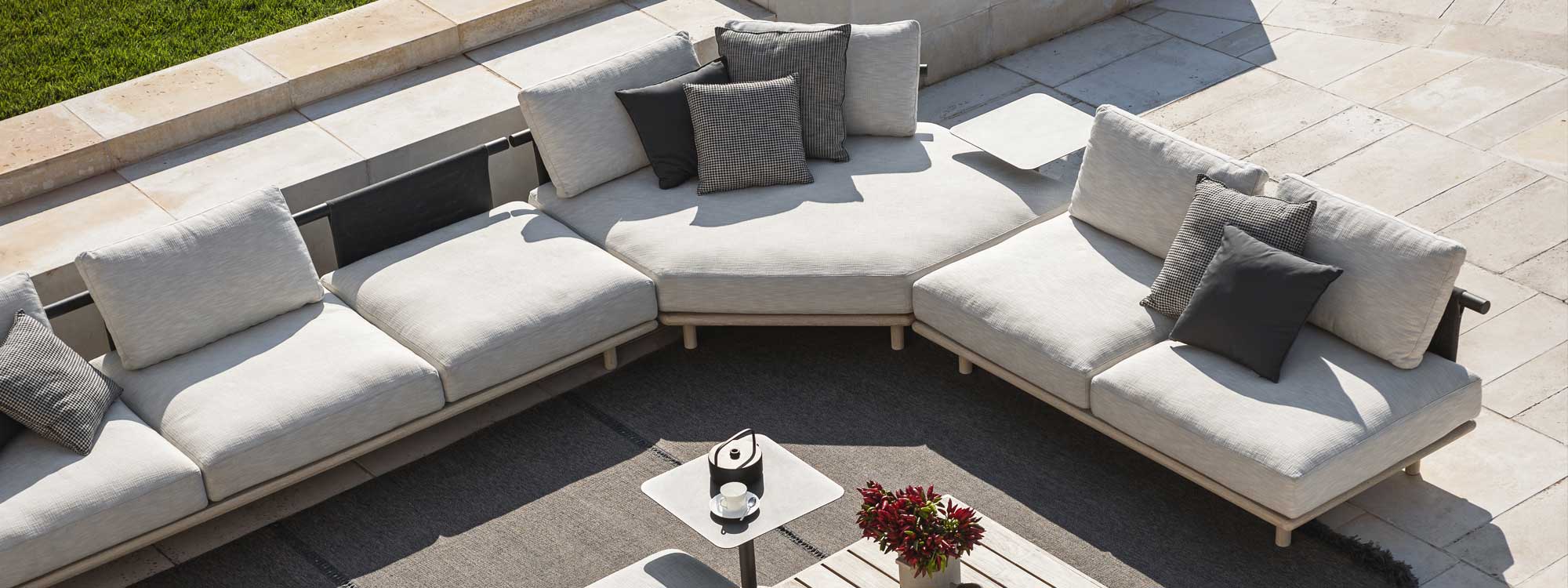 Image of aerial view of RODA Eden minimalist garden sofa, showing hexagonal corner unit, with Double ottoman, Bernardo low table and Eden low table in the center