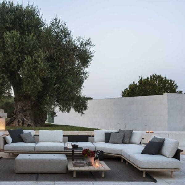 Dusk shot of Eden modern garden corner sofa on sultry terrace