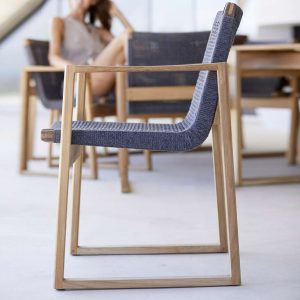 Image of side view of Caneline Aspect garden chair, showing profile of its stylish hardwood frame and woven seat and back in dark-grey SoftRope