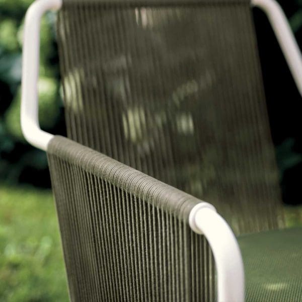 Image of detail of Harp outdoor carver chair's white tubular arm and olive acrylic cord