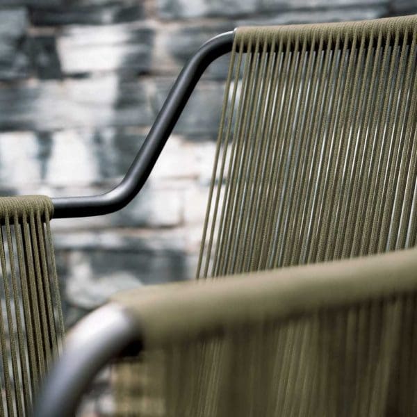 Image of detail of RODA Harp modern garden armchair with smoke colored frame and olive cord arms and back