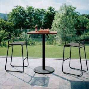 Image of pair of Harp black garden bar stools and Stem bar table with circular teak top