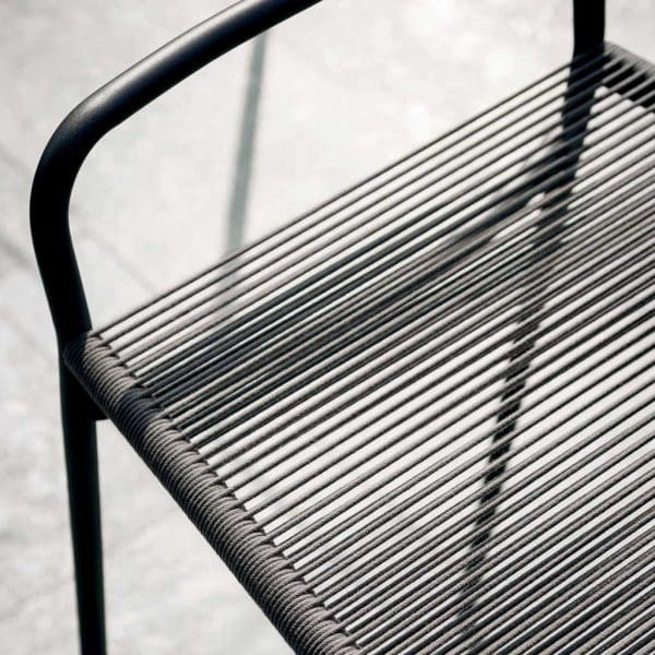 Image of detail of Harp exterior bar stool's tubular frame and acrylic cord seat by RODA