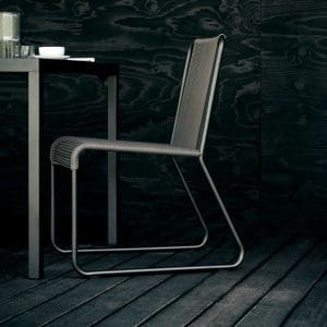 Image of Harp minimalist garden chair by Rodolfo Dordini on black floor