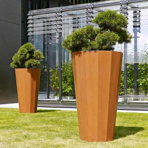 Image of Iris large vertical planter, which is a tall dodecagonal planter (12 sided) in oxidised corten steel