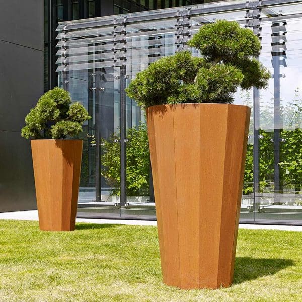 Image of Iris large vertical planter, which is a tall dodecagonal planter (12 sided) in oxidised corten steel