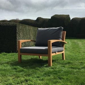 Image of IXIT teak garden chair on lawn by Royal Botania