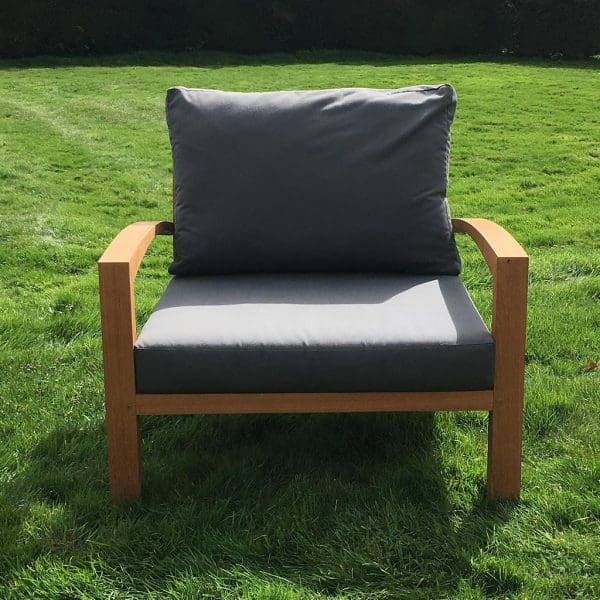 Image of IXIT easy chair with teak frame and plump outdoor cushions by Royal Botania