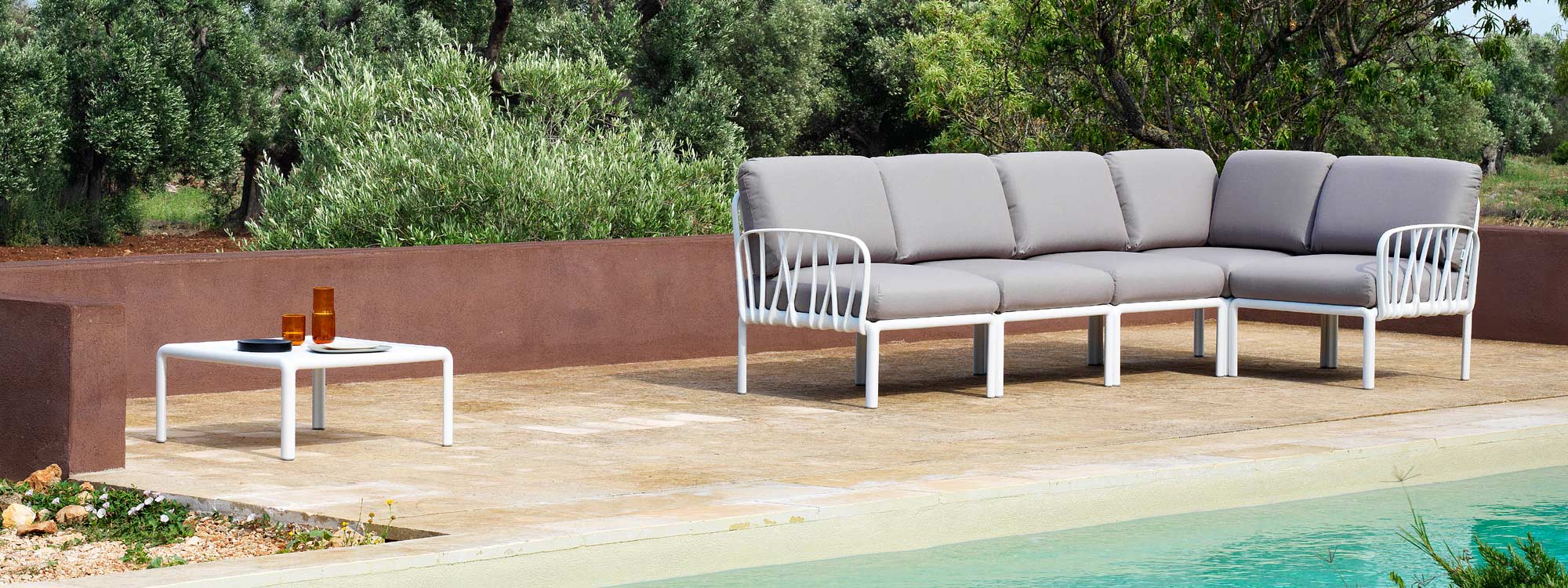 Image of Komodo small white outdoor corner sofa with grey cushions and white low table by Nardi
