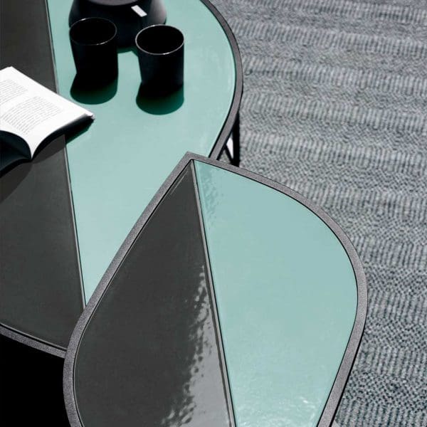 Image of 2 different sizes of RODA Leaf modern outdoor low tables with glazed gres ceramic table tops