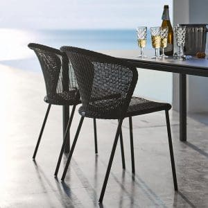 Image of black Lean woven garden chairs and black Caneline table