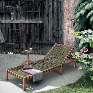 Image of RODA Mistral teak sun lounger with Olive webbing on shaded terrace