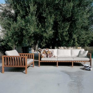 Image of RODA Mistral 3 seat teak sofa and lounge chair with White cushions on Mediterranean terrace
