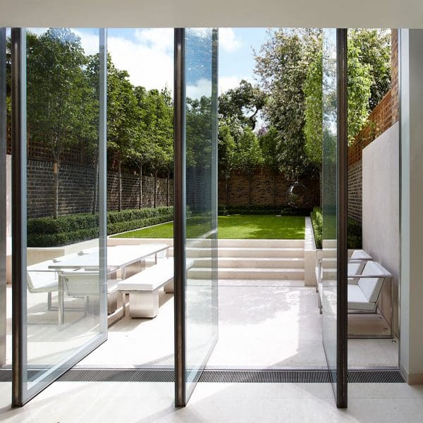 Image looking out of London town house onto terrace and back garden, with FueraDentro minimalist garden furniture