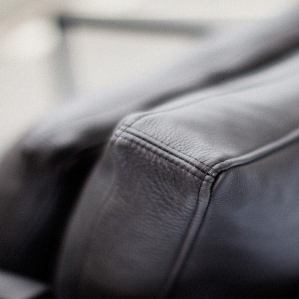 Image of detail of black leather cushion of Monaco modern indoor sofa