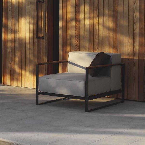 Image of Roshults Moore modern outdoor lounge chair in late afternoon sun and shade
