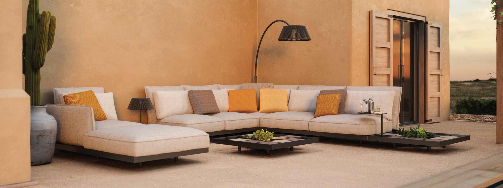 Image of Royal Botania Mozaix Alu corner sofa in front of terracotta house