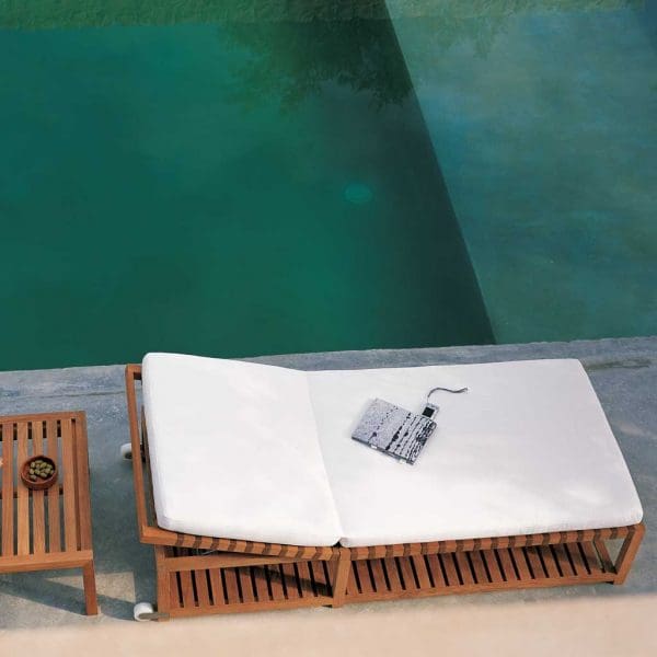 Image of Birdseye view of RODA Network modern sun lounger with White cushion next to swimming pool