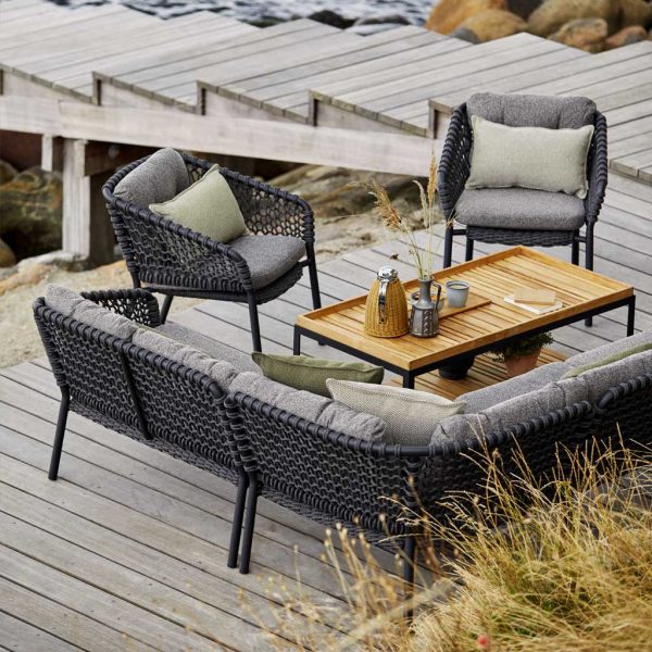 Image of birds eye view of Ocean grey corner sofa and lounge chairs around Level teak low table by Caneline garden furniture