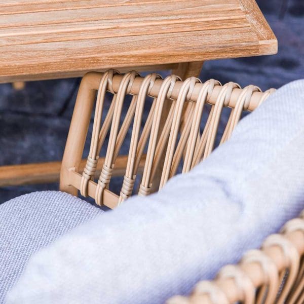 Image of Cane-line Ocean bamboo garden chair next to Flip folding teak table