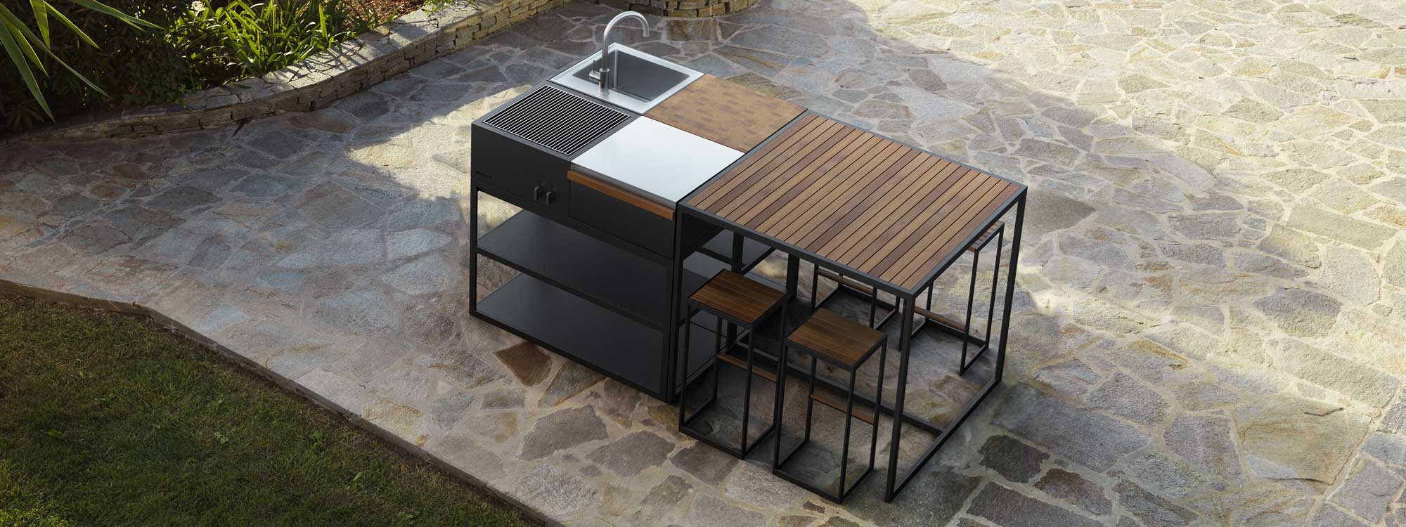 Image of aerial view of configuration of Open Kitchen bbq and outdoor sink, together with Open Bistro high bar table and bar stools in teak and anthracite stainless steel