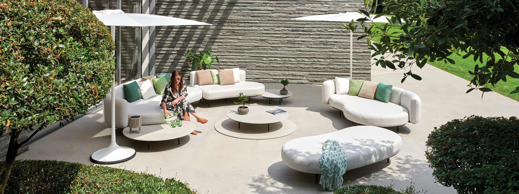 Image of sun soaked courtyard with Organix garden sofas and Palma parasols by Royal Botania