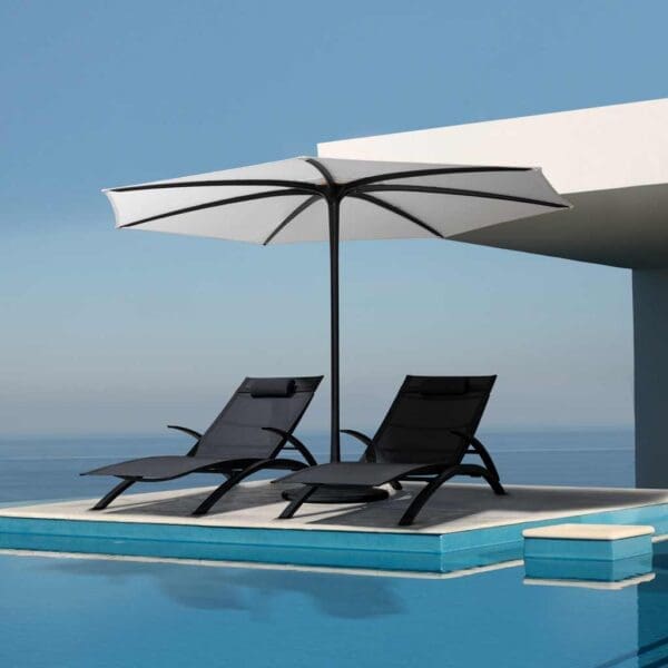 Image of pair of black OZON sun beds beneath black & white Palma parasol by Royal Botania