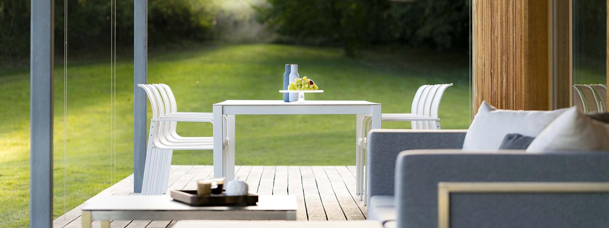 Image of Puro modern garden dining set & Lotos outdoor sofa on decking