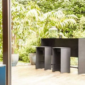 Image of RIVA outdoor bar stool and high bar table in anthracite HPL with simple linear design by Conmoto