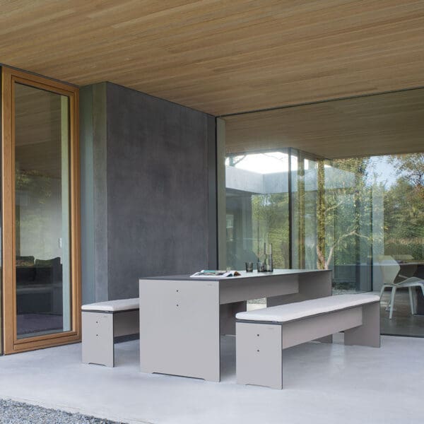 Image of RIVA taupe table and bench set on modern outdoor covered terrace