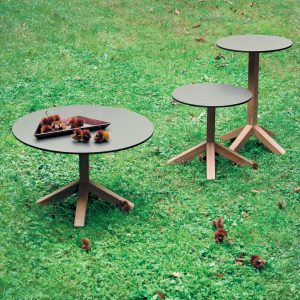 Image of 3 different sizes of Root small teak garden tables with round grey table tops by RODA, which have design inspired by roots of a tree