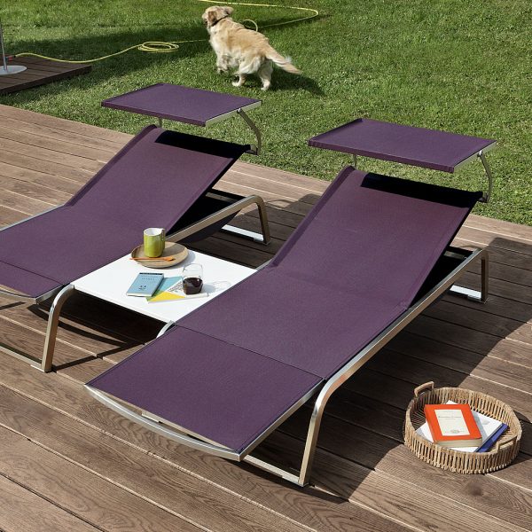 Image of pair of Coro L3 sun loungers with sun shades, shown with aubergine coloured fabric and anodized aluminium frames.
