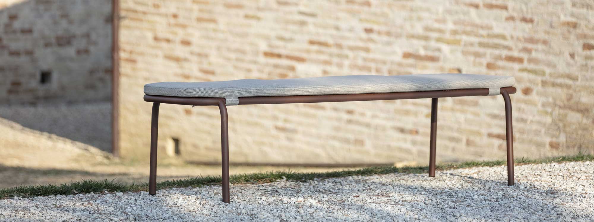 Image of Todus modern garden bench seat in tubular and mesh stainless steel, designed by Studio Segers