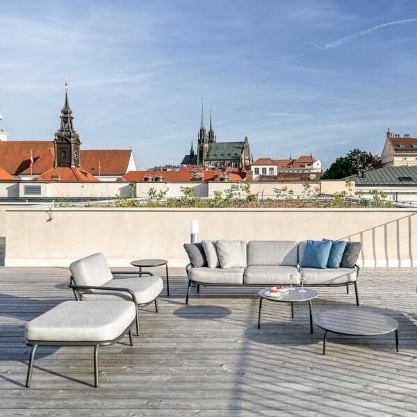 Image of Todus Starling lounge furniture on rooftop terrace in Czech Republic with church spires in background