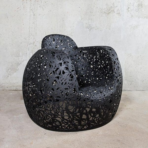 Image of side view of Stellar garden lounge chair by Unknown Nordic, shown against concrete background