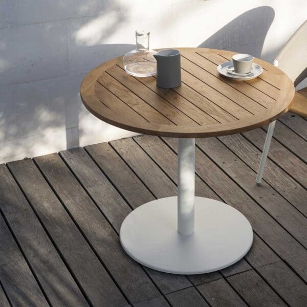 Image of RODA Button round bistro table with white circular base and planked teak round table top