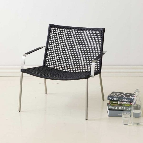 Image of Straw garden relax chair with stainless steel frame and black Cane-line Rope seat and back.