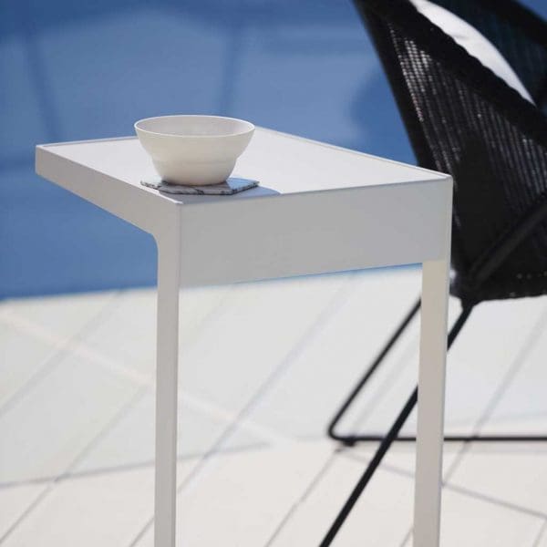 Image of white Time Out cantilever side table by Caneline outdoor furniture