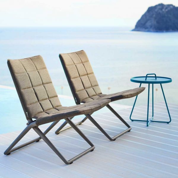 Image of pair of grey Traveller folding chairs and Aqua On The Move side table by Cane-line Danish garden furniture