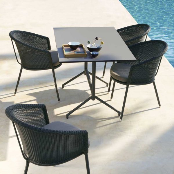 Image of Trinity stacking garden chairs by Caneline on poolside