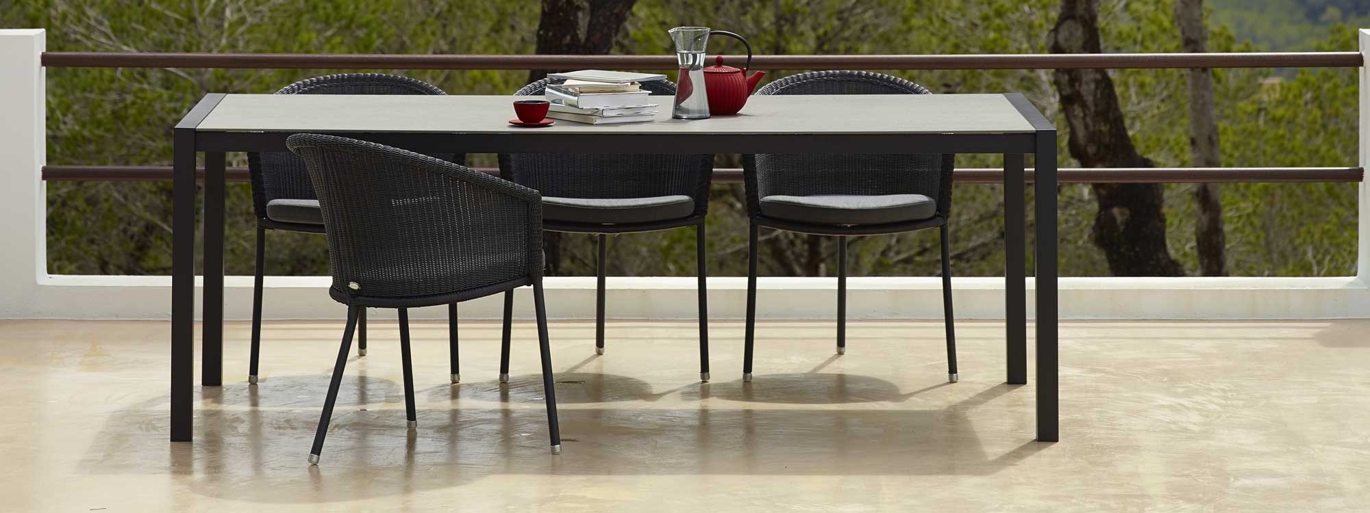 Image of Trinity 3 legged garden chairs in graphite Cane-line weave by Caneline garden furniture company