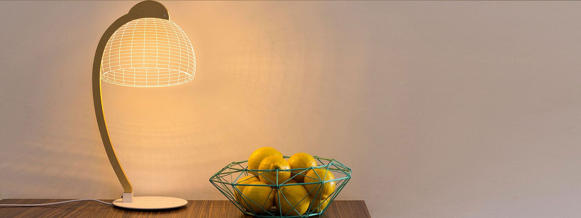 Image of Studio Cheha Dome LED desk lamp next to a bowl of lemons