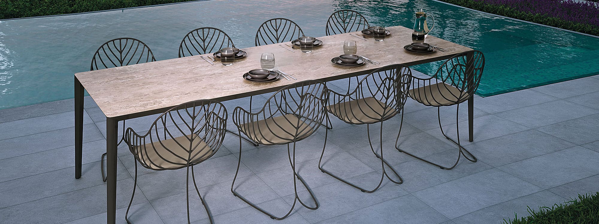 Image of Unite bronze garden table with Travertine ceramic top & bronze Folia chair by Royal Botania