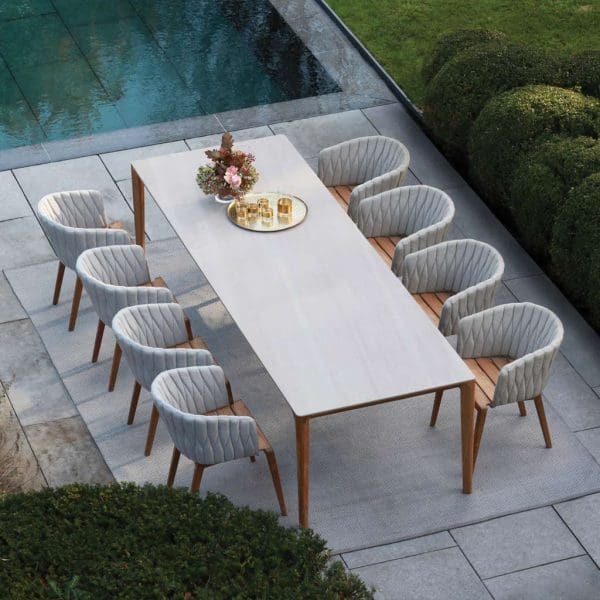 Image of Calpyso garden chairs and U-nite teak table with ceramic top by Royal Botania