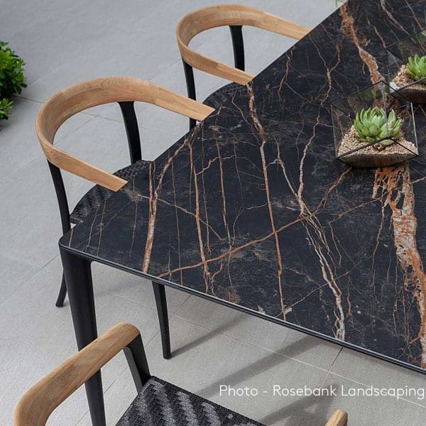Image of UNITE table with Volcano Black ceramic top & anthracite-colored Jive chairs by Royal Botania