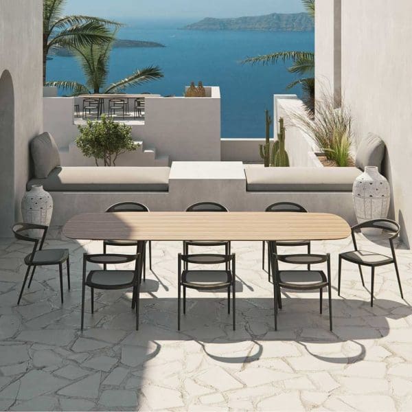 Image of Royal Botania Styletto modern garden furniture shown on white-washed terrace with Aegean sea in background