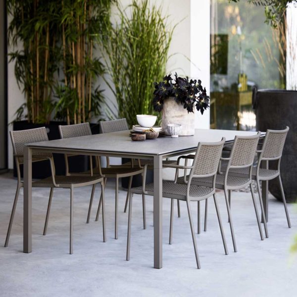 Image of taupe Pure garden dining table with taupe Less dining chairs by Caneline