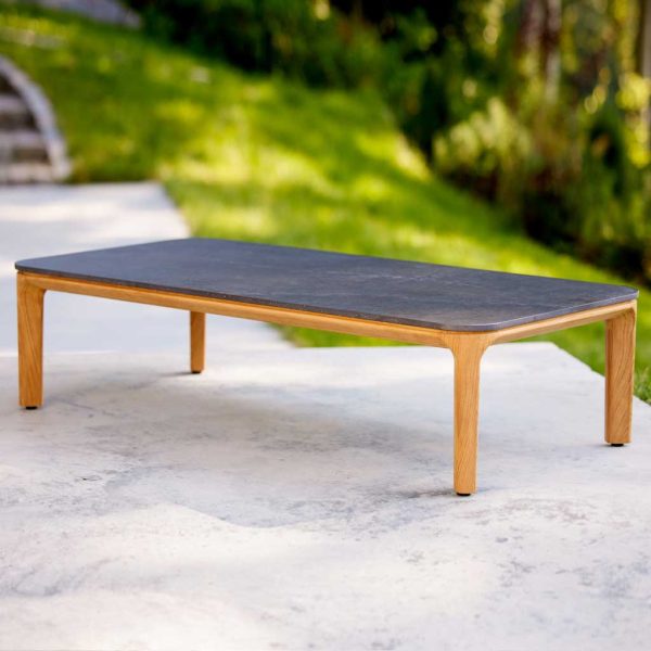Image of Aspect teak outdoor low table with fossil-black ceramic top by Cane-line
