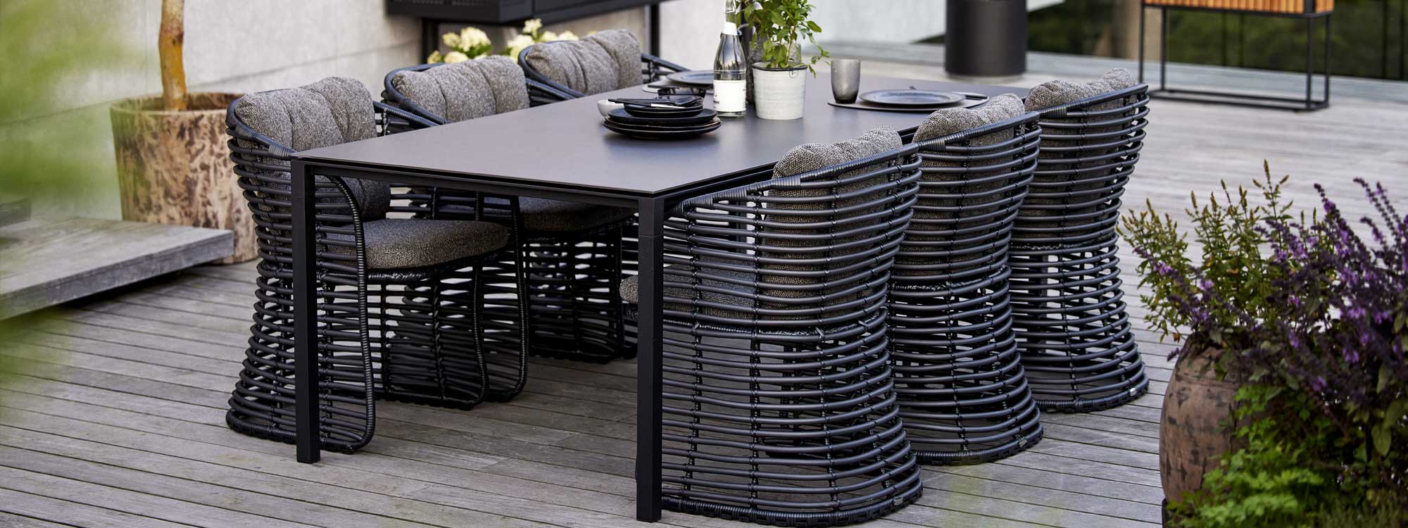 Image of graphite Basket chairs with Lava Grey Pure garden table by Caneline