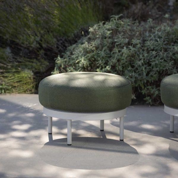 Image of Baza circular garden pouf with white frame and legs and plump green cushion